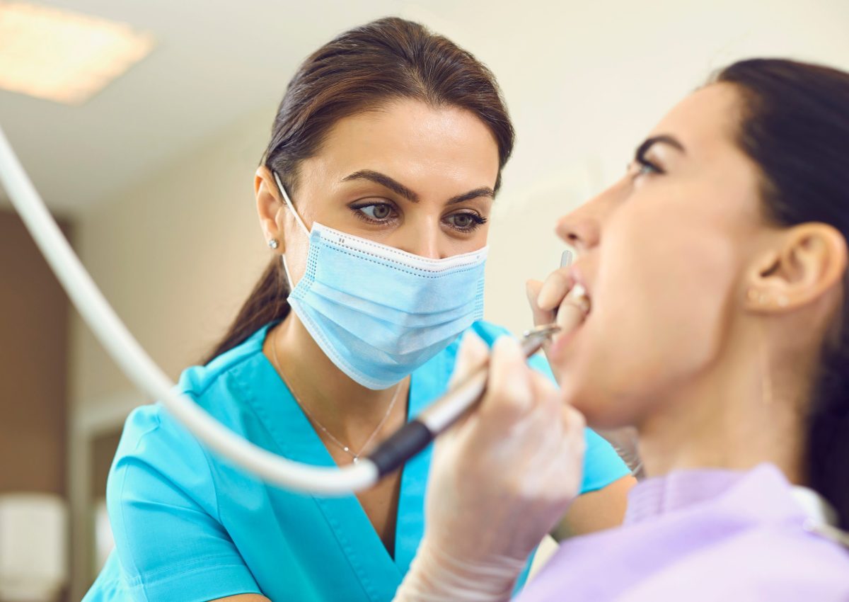 Dentist,At,Work.,Concentrated,Female,Specialist,Removing,Tooth,Stone,From